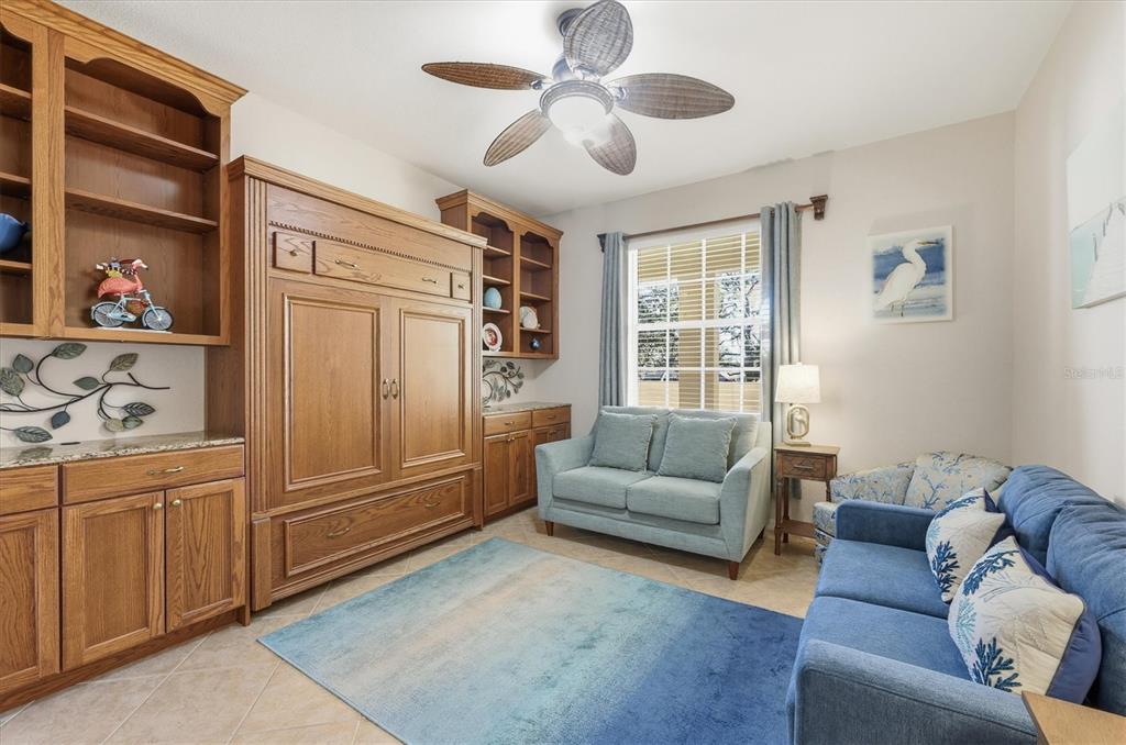 980 Cooper Street, Unit 201 Venice, FL 34285 - Photo 19 of 87 a living room with furniture and a window