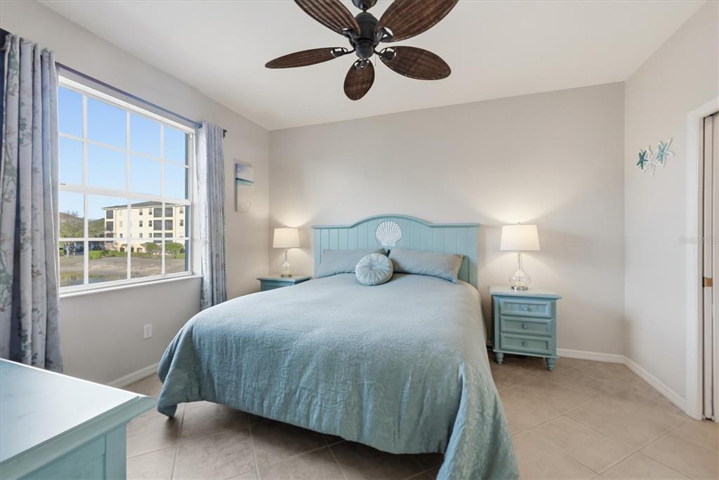 980 Cooper Street, Unit 201 Venice, FL 34285 - Photo 20 of 87 a bedroom with a bed and window