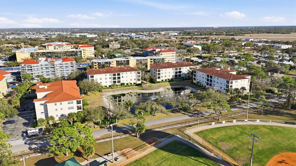 980 Cooper Street, Unit 201 Venice, FL 34285 - Photo 39 of 87 an aerial view of residential houses with outdoor space