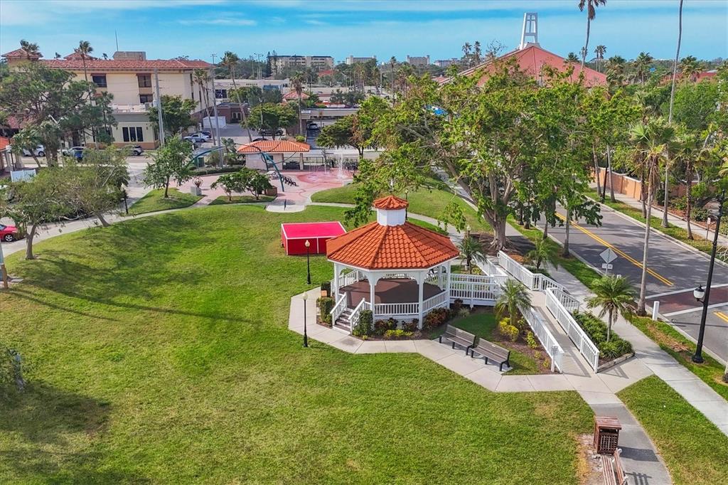 980 Cooper Street, Unit 201 Venice, FL 34285 - Photo 60 of 87 an aerial view of a house with a garden and swimming pool