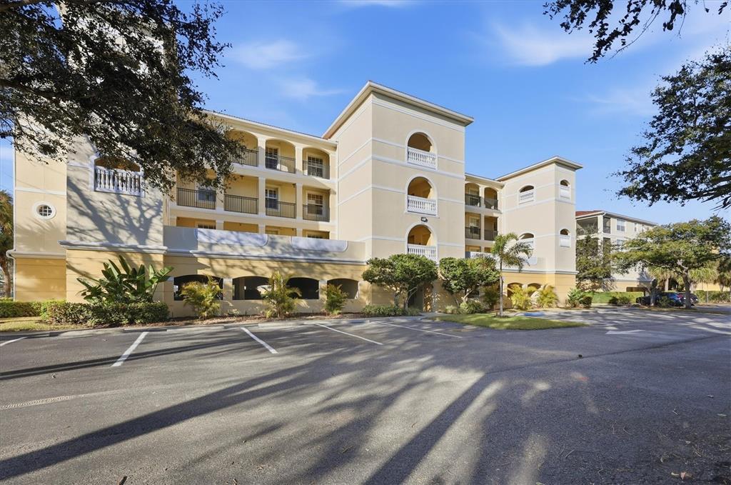 980 Cooper Street, Unit 201 Venice, FL 34285 - Photo 6 of 87 a front view of a building with street view