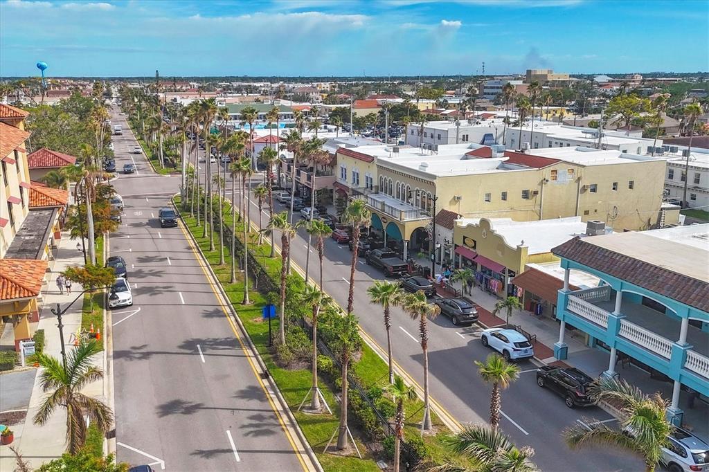 980 Cooper Street, Unit 201 Venice, FL 34285 - Photo 85 of 87 an aerial view of a city with lots of residential buildings ocean and mountain view in back