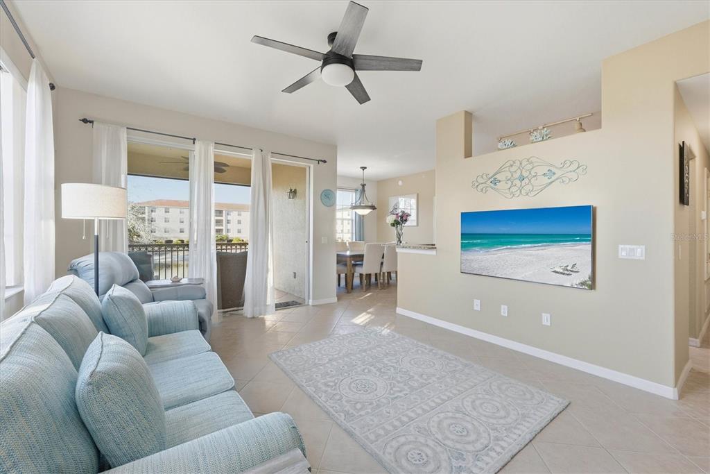980 Cooper Street, Unit 201 Venice, FL 34285 - Photo 9 of 87 a living room with furniture and a rug