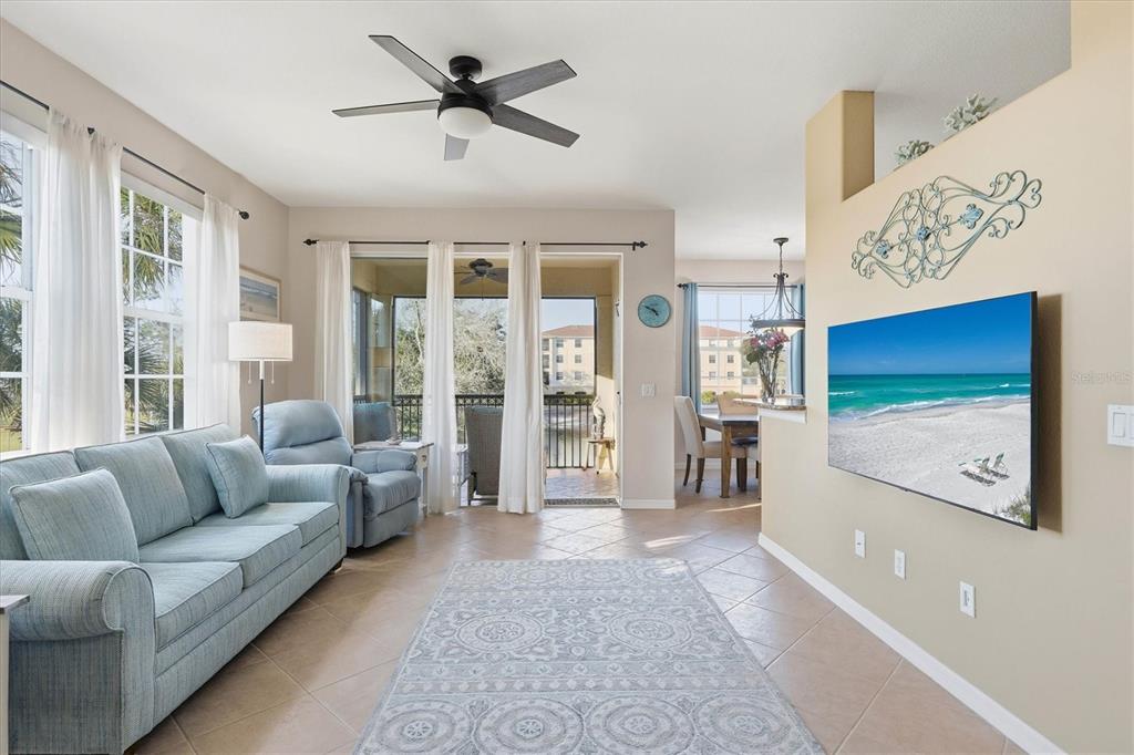 980 Cooper Street, Unit 201 Venice, FL 34285 - Photo 10 of 87 a living room with furniture and a large window