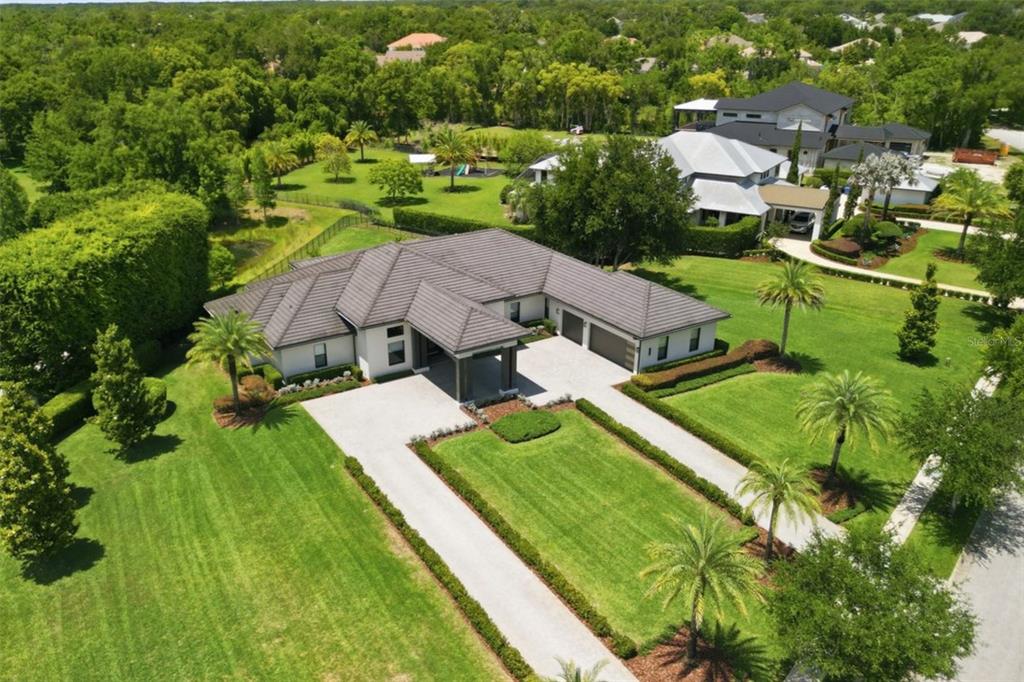 2829 Coastal Range Way Lutz, FL 33559 - Photo 63 of 64 an aerial view of residential houses with outdoor space and street view
