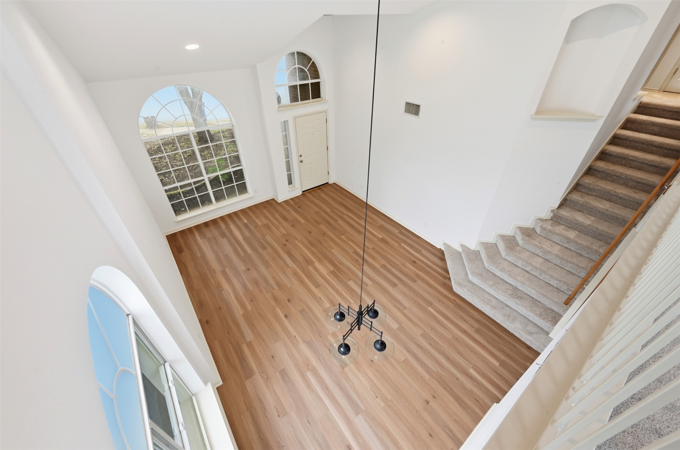 3629 Ruby Red Drive Austin, TX 78728 - Photo 24 of 35 View from loft, shows foyer featuring stairs and entry