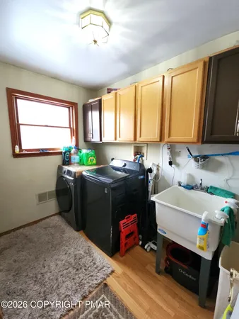 a bathroom with a sink toilet mirror and vanity