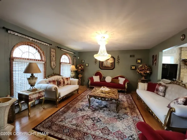 a spacious bedroom with bed and window