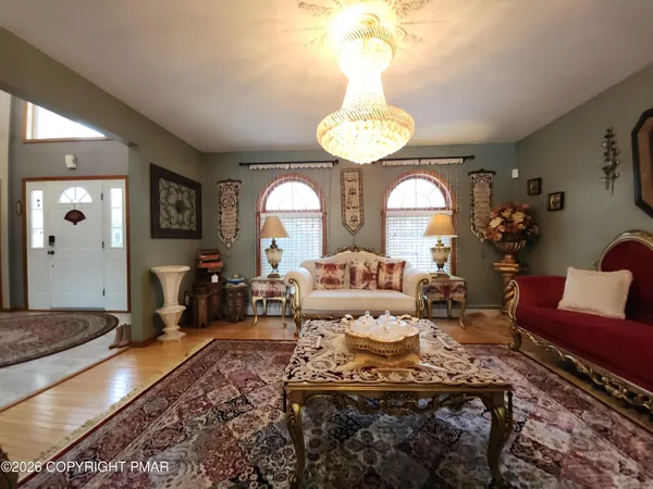 a bed room with a bed mirror and a window