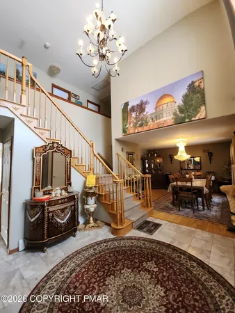 a view of a hallway with a couch and dining table view