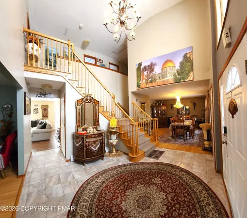 a large kitchen with stainless steel appliances granite countertop a lot of counter space and wooden floor