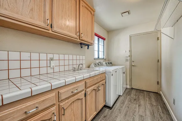 a bathroom with a sink double vanity and a mirror