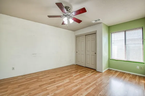 a bathroom with a bathtub and next to a window