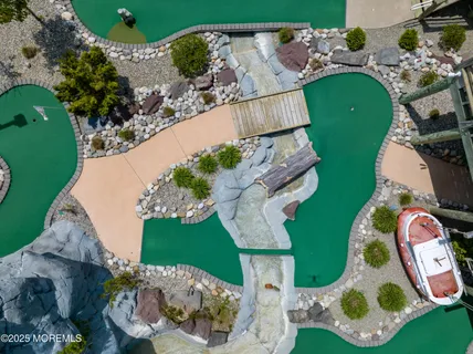 an aerial view of a house swimming pool and outdoor space