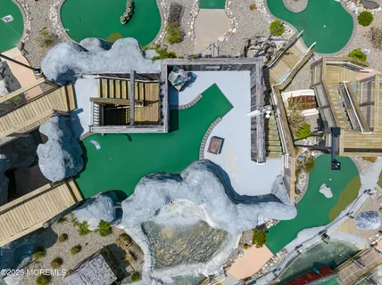 an aerial view of a house with a swimming pool