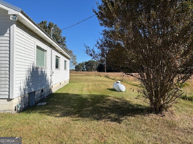 4316 Sharon Road Washington, GA 30673 - Photo 11 of 30 a view of a house with a yard