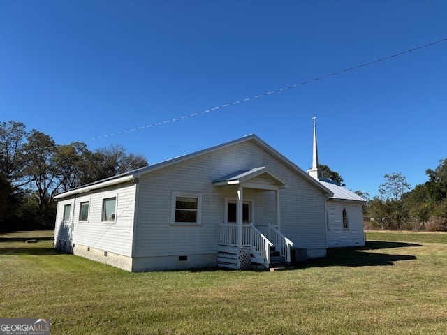 4316 Sharon Road Washington, GA 30673 - Photo 12 of 30 a front view of a house with a garden