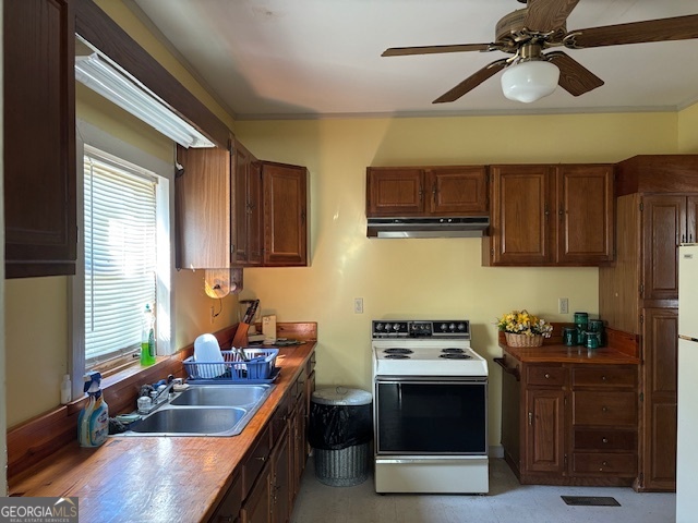 4316 Sharon Road Washington, GA 30673 - Photo 22 of 30 a kitchen with stainless steel appliances a stove sink and cabinets