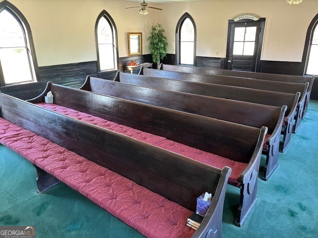 4316 Sharon Road Washington, GA 30673 - Photo 27 of 30 a living room with a bed and a large window