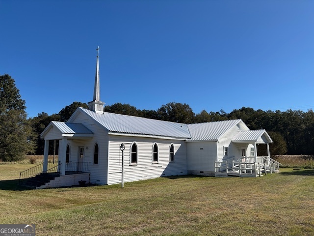 4316 Sharon Road Washington, GA 30673 - Photo 8 of 30 a front view of a house with a garden