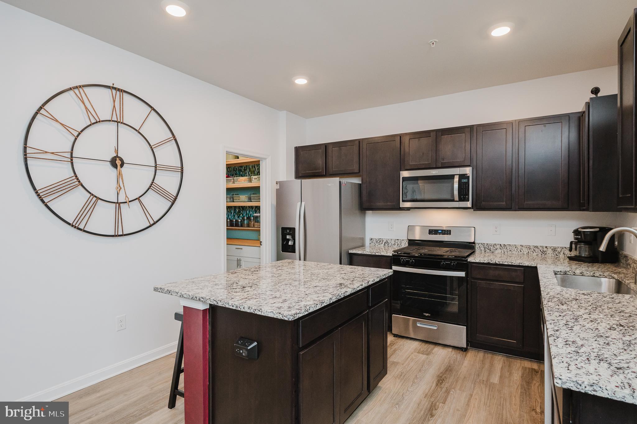 976 Pagonia Road Joppa, MD 21085 - Photo 14 of 69 a kitchen with stainless steel appliances granite countertop a stove refrigerator and a sink