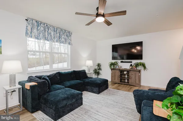 a view of walk in closet with clothes
