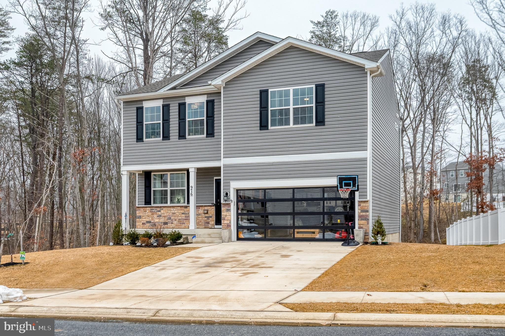 976 Pagonia Road Joppa, MD 21085 - Photo 2 of 69 a front view of a house with a yard and garage