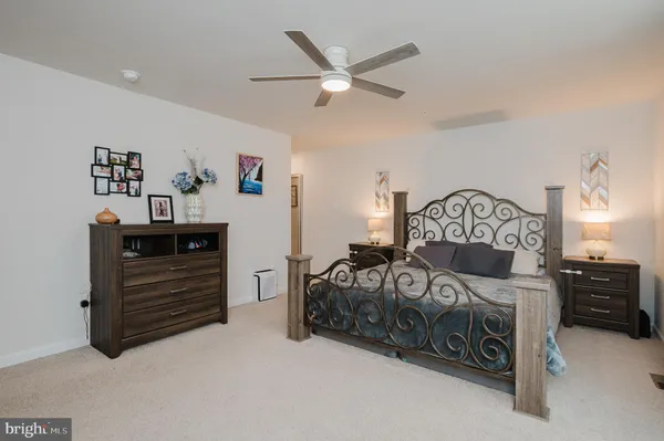 a view of a workspace with a window and a potted plant