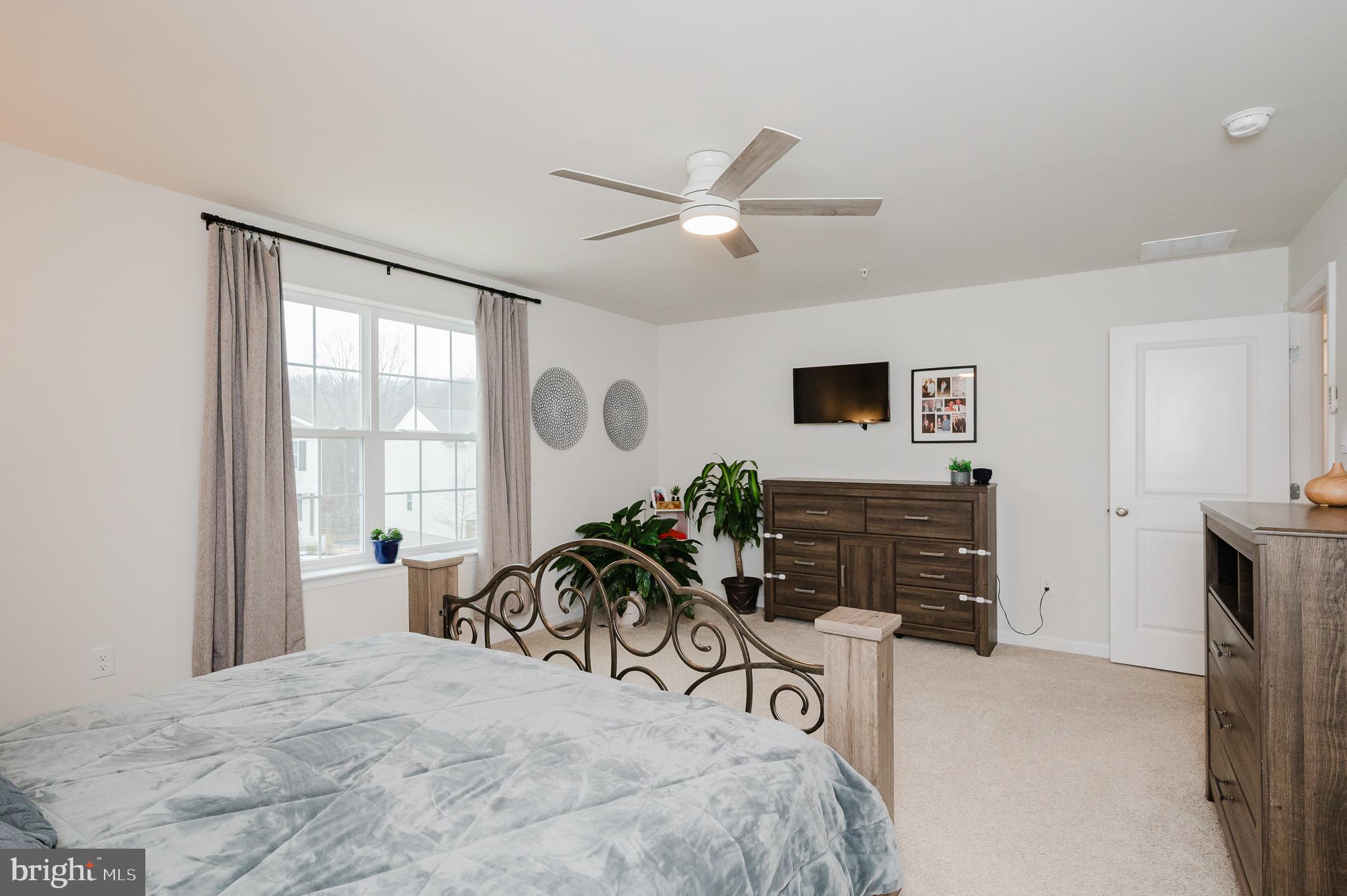 976 Pagonia Road Joppa, MD 21085 - Photo 25 of 69 a view of a livingroom with furniture and a ceiling fan