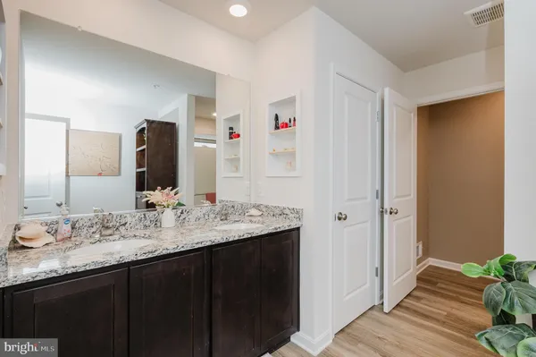 a bedroom with a bed and a chair