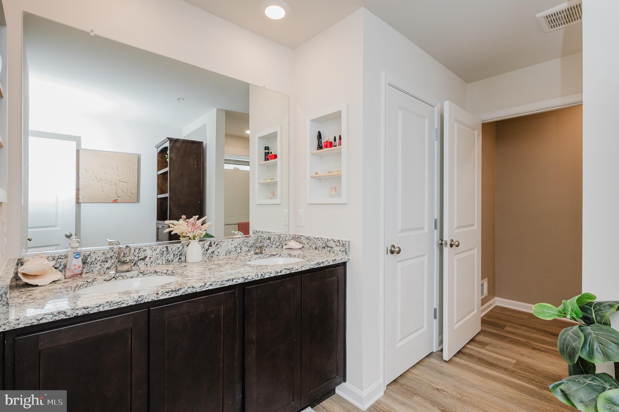 976 Pagonia Road Joppa, MD 21085 - Photo 30 of 69 a bathroom with a granite countertop sink and a mirror