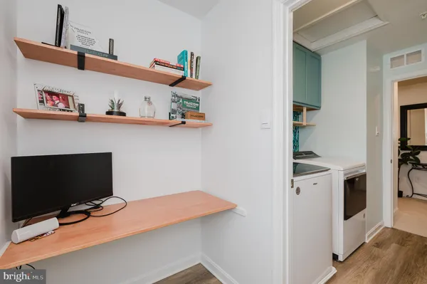 a room with furniture and a potted plant