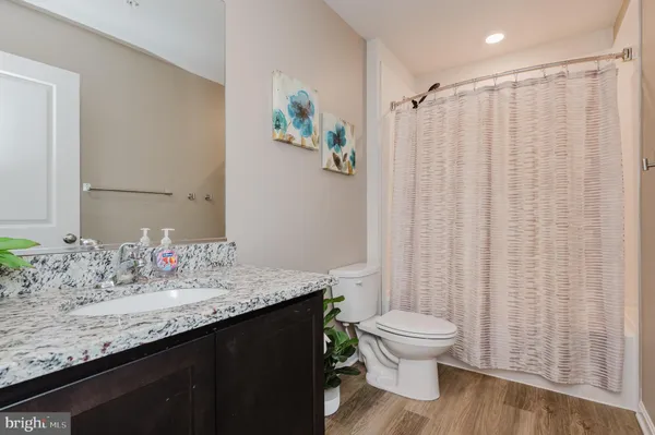 a view of balcony with couch and wooden fence