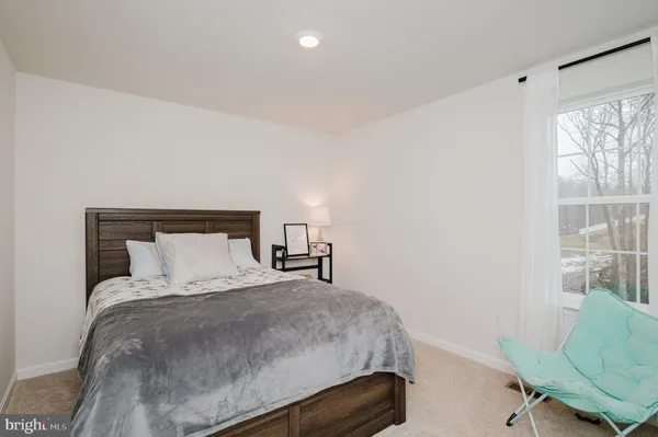 a view of deck with table and chairs and wooden floor