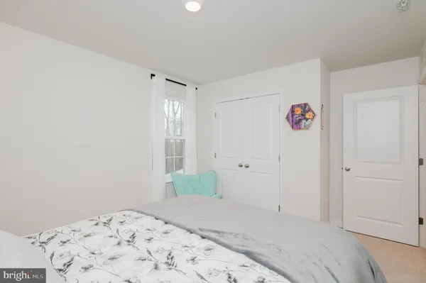 a view of a swimming pool with a table and chairs in the patio