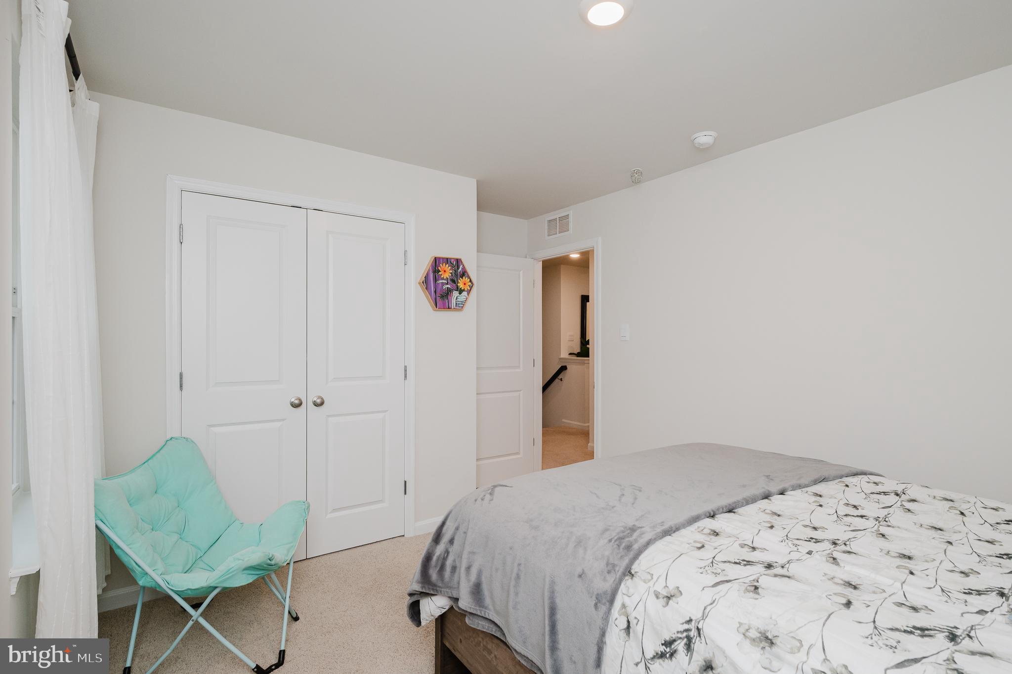 976 Pagonia Road Joppa, MD 21085 - Photo 43 of 69 a bedroom with a bed and a chair