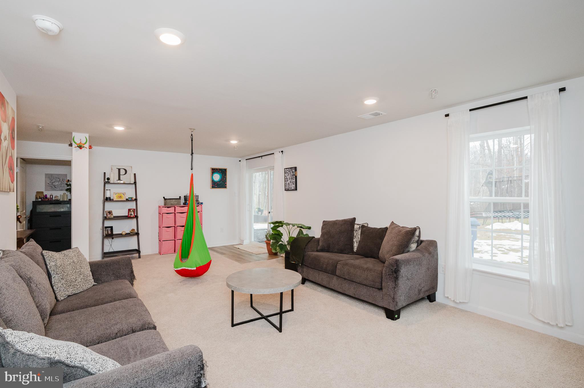 976 Pagonia Road Joppa, MD 21085 - Photo 45 of 69 a living room with furniture and a wooden floor