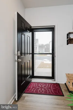 a view of a workspace with furniture and book shelf