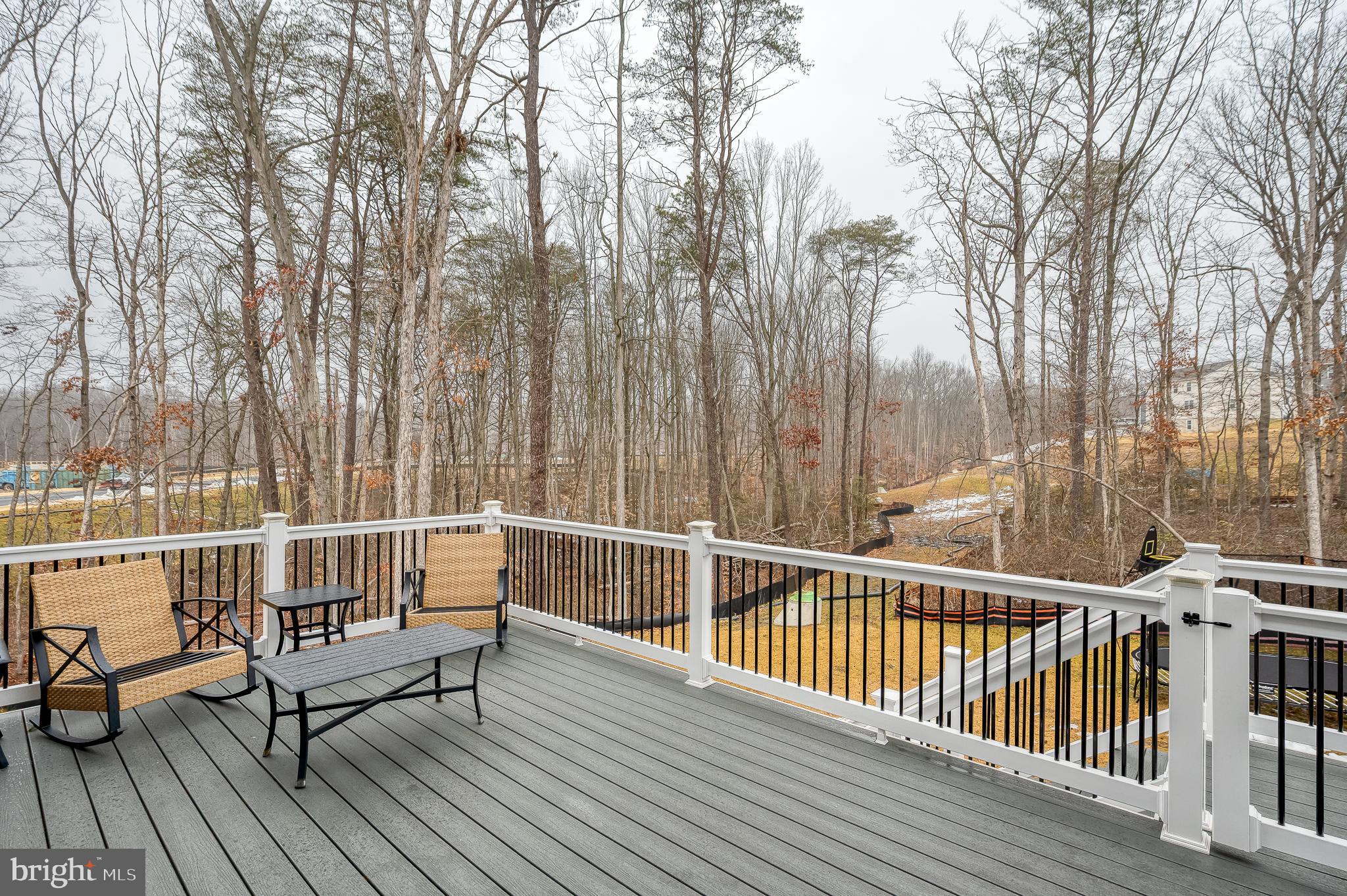 976 Pagonia Road Joppa, MD 21085 - Photo 54 of 69 a view of balcony with couch and wooden fence