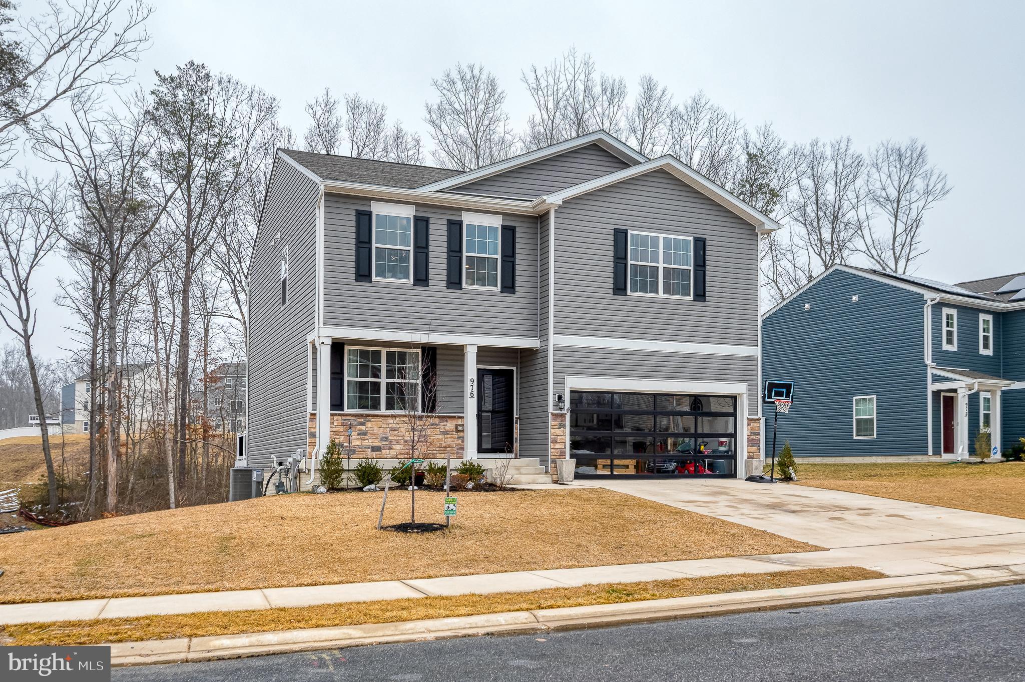 976 Pagonia Road Joppa, MD 21085 - Photo 62 of 69 a front view of a house with yard and trees