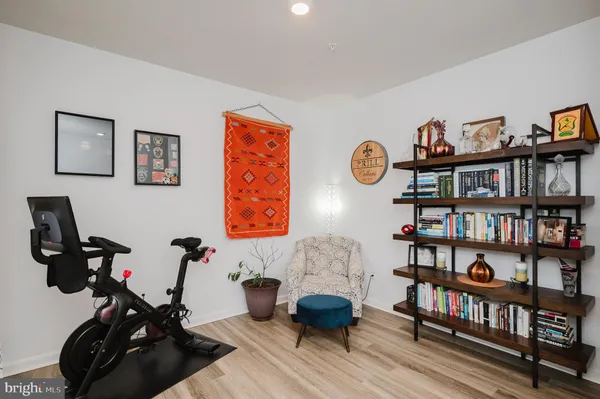 a kitchen with granite countertop a table and chairs in it