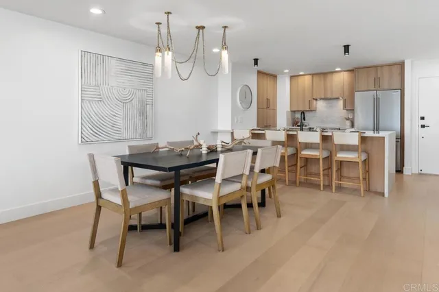 a living room with stainless steel appliances kitchen island granite countertop furniture and a kitchen view