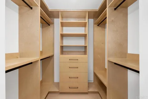 a view of a hallway with seating area