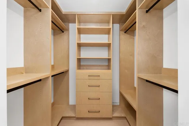 a view of a hallway with seating area