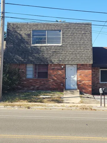 a view of a entryway door front of a house