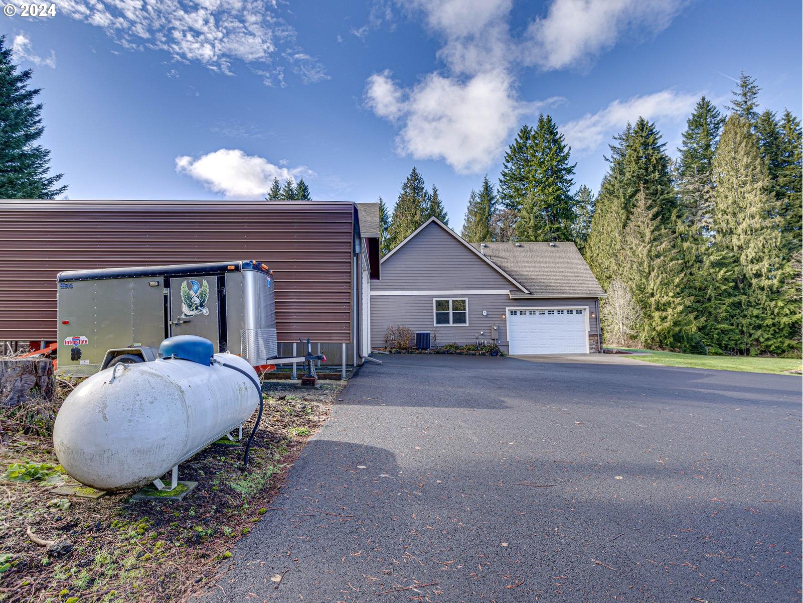 45544 Southeast Dowling Road Sandy, OR 97055 - Photo 11 of 48 a view of a house with backyard and garden