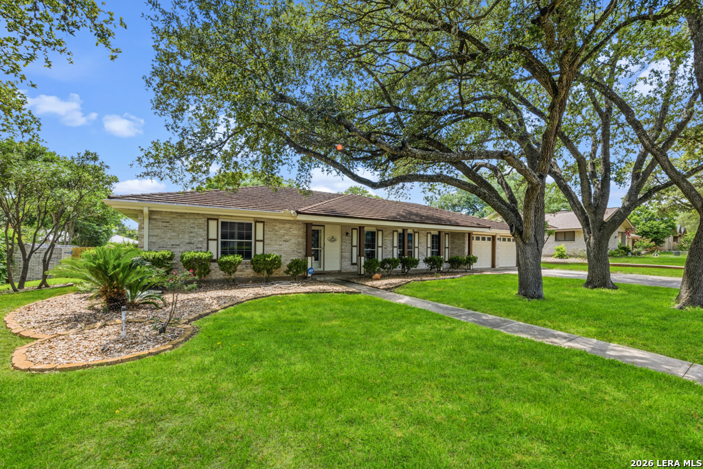 6022 Winding Ridge Drive Windcrest, TX 78239 - Photo 1 of 31 a front view of house with yard and green space