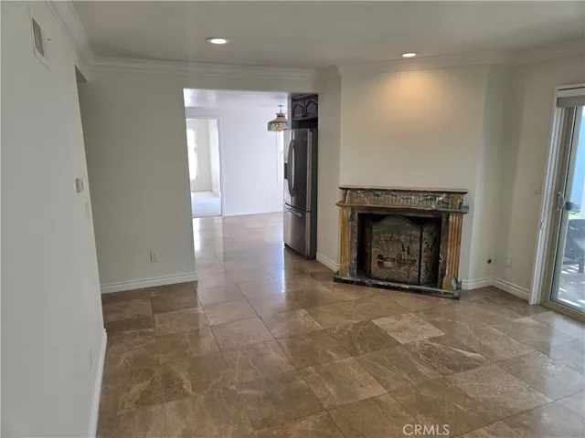 a kitchen with a refrigerator and a stove top oven