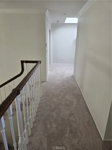 an entryway of a house with a hallway