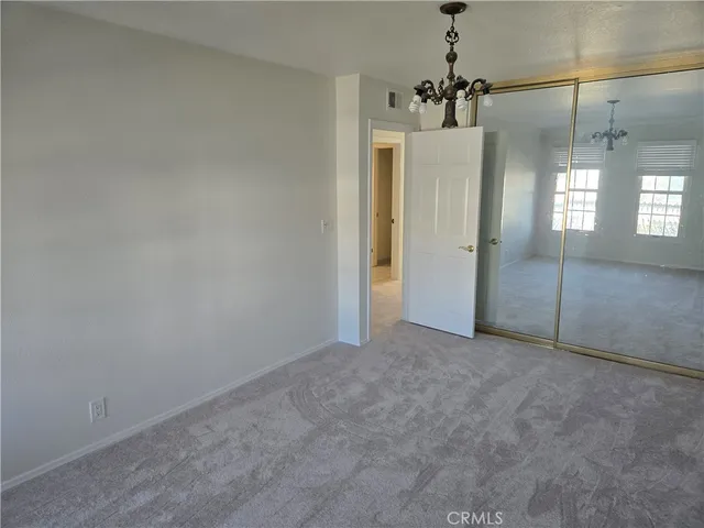 a bathroom with a double vanity sink a mirror and a bathtub